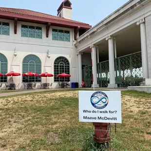 a sign in front of a building