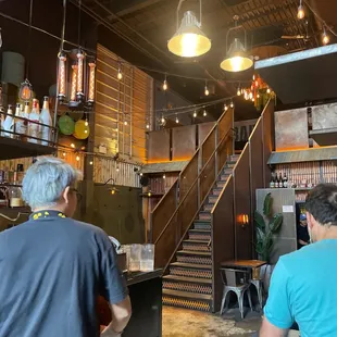 two men sitting at a counter