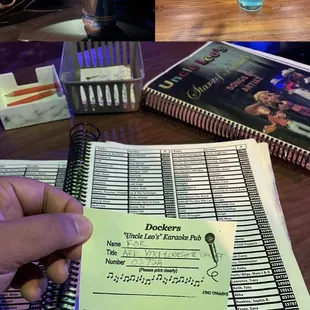 a hand holding a notepad