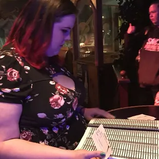 a woman reading a menu