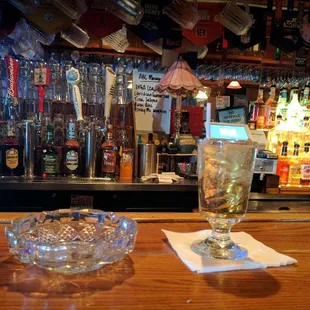 a glass of alcohol on a bar