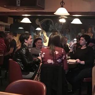 a group of people sitting at a table