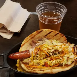 Pita and pork and hot dog and plantain chips