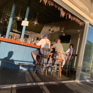 people sitting at the bar