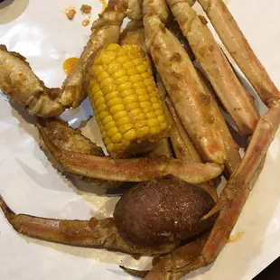 Crabs legs with corn and potato
