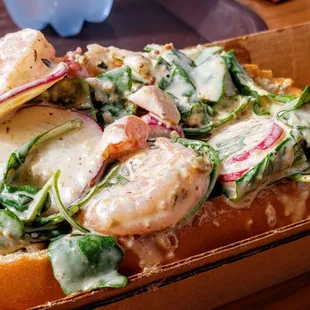 Shrimp Roll- arugula, tomato, pickled fennel, and radish, Rémoulade sauce on a brioche butter bun w/chips - Excellent!
