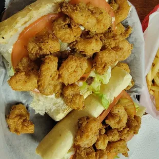 a basket of fried food and a basket of fries