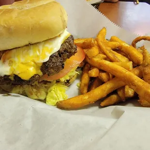 a burger and french fries in a basket