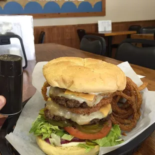 You may have to dislodge your jaws to eat the double but it's worth it! The onion rings are homemade and delicious.