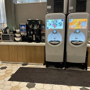 Coca-cola freestyle station for refills or fountain drinks. Along with coffee machines and a microwave.