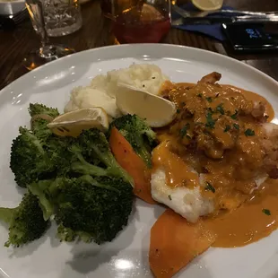 Baked haddock with shrimp and scallops. With a newberg sauce