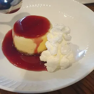 The cheescake with rasberry sauce. So yummy and she couldn&apos;t wait to dig in, hence the spoon.
