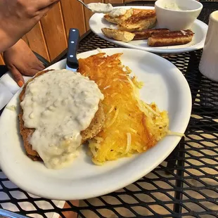 Country fried steak (no eggs) extra gravy, sausage and biscuit