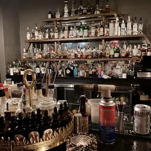a bar filled with bottles of liquor