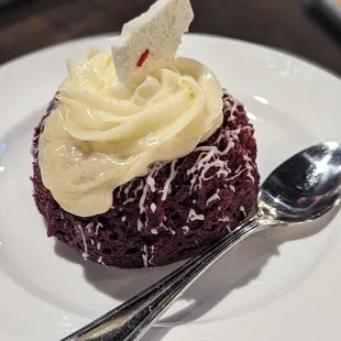 a red velvet cupcake with whipped cream