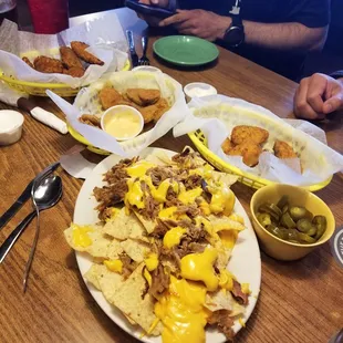 The nachos left a lot to be desired but the fried pickles and jalepeno poppers were great!