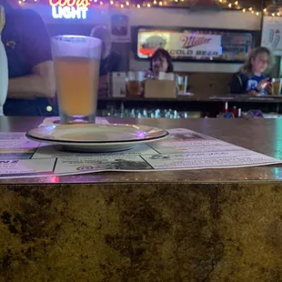 a glass of beer on a table