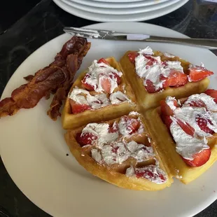 a plate of waffles and bacon