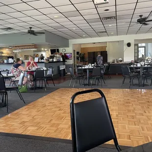 a restaurant with tables and chairs