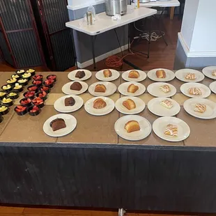a table of pastries and desserts