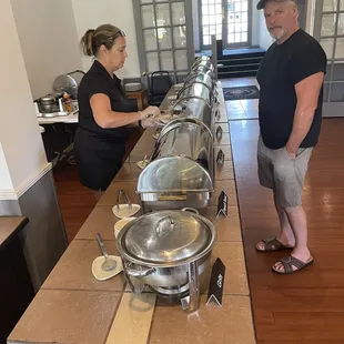 a man and a woman in a kitchen