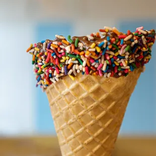 an ice cream cone with sprinkles