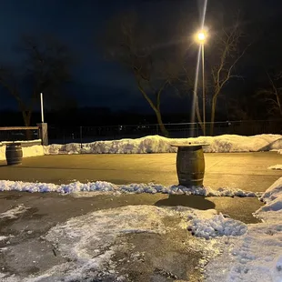 a snowy parking lot at night