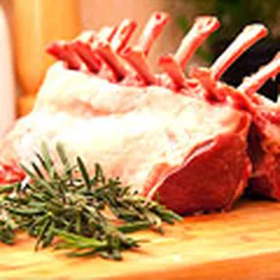 a rack of meat on a cutting board