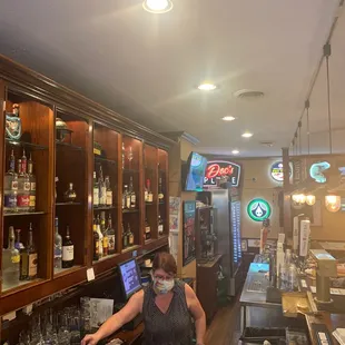 a woman behind the bar