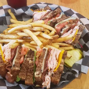 Club sandwich with fries