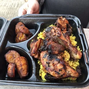 Large portion Jerk Chicken with island fried rice and fried plantains (plantains are when available but totally worth it)