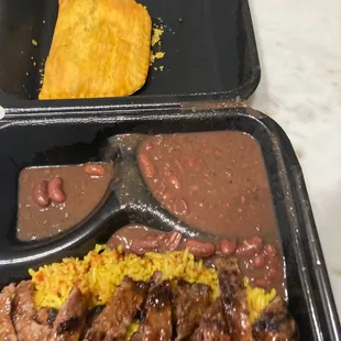Jerk Pork Platter with Island Fried Rice and Stewed Red Beans.  Beef Pattie