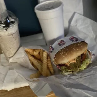 a hamburger and french fries on a table