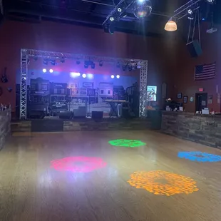 a dance floor with colored lights
