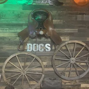 old wagon wheels and a sign