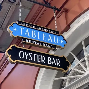 a tableau restaurant and oyster bar sign