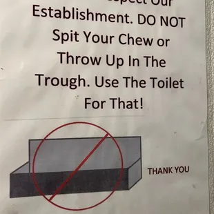 a sign stating to wash the toilet