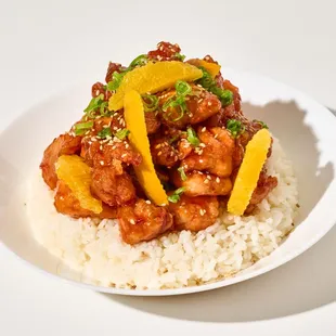 Orange chicken - white rice, oranges, sambal, sesame seeds, scallions