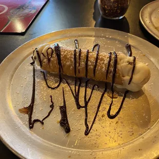 Cannoli with chocolate sauce