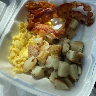 Scrambled eggs home fries and bacon