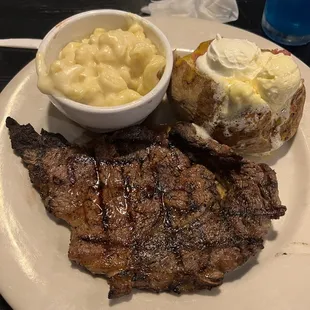 Ribeye steak fully loaded potato and macaroni and cheese