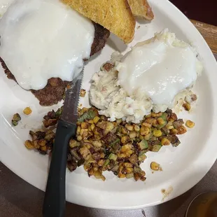 Chicken fried steak with mashed potato and corn