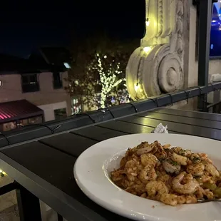 a plate of food on a balcony