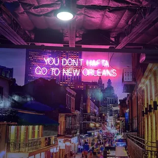 a neon sign that says you don't think go to new orleans