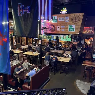 people sitting at tables in a restaurant
