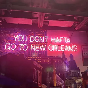 a neon sign that says you don't traffic go to new orleans