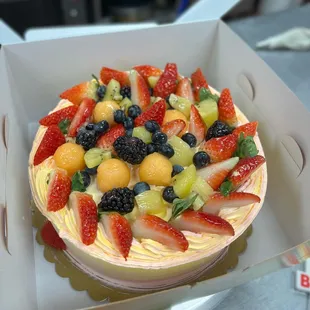 A 8&quot; cake with extra extra fruit on top