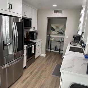 a kitchen with stainless steel appliances
