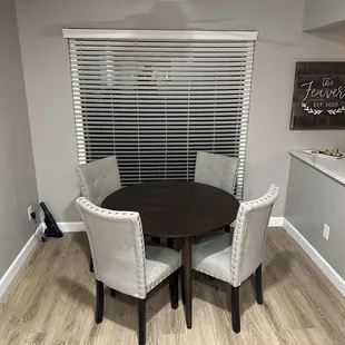 a dining room table and chairs