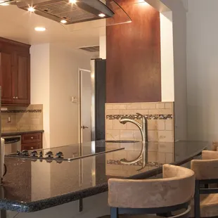 A complete gut kitchen remodel. Beautiful colors, great products. The small prep sink is next to the cook top...